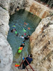 people swimin at cenote koleeb caab