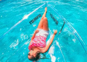 young girl in a clear boat